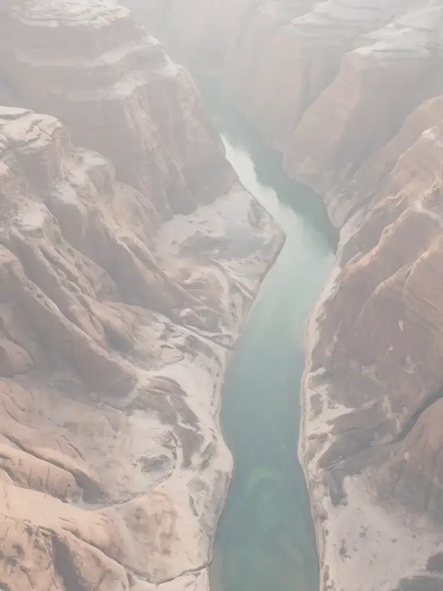 Aerial view of a river cutting through a desert canyon, conveying controlled navigation in enterprise cybersecurity consultancy
